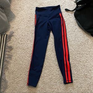 blue leggings with red stripes